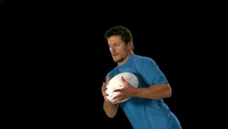 Serious-rugby-player-catching-ball