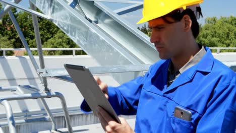 male worker using digital tablet at solar station 4k