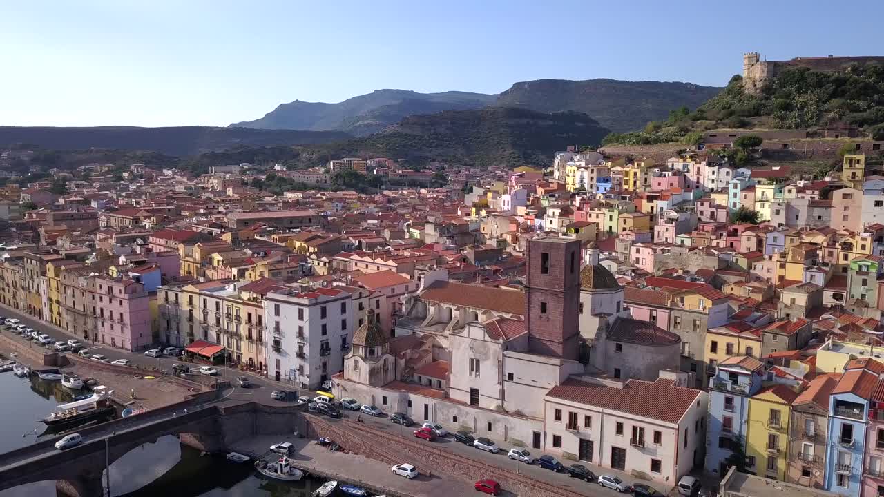 Bosa, Sardinia, Italy -Drone Aerial Shot over the colourful town of Bosa and its castle. A typical Italian and mediterranean landscape