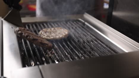 preparing burgers on a grill