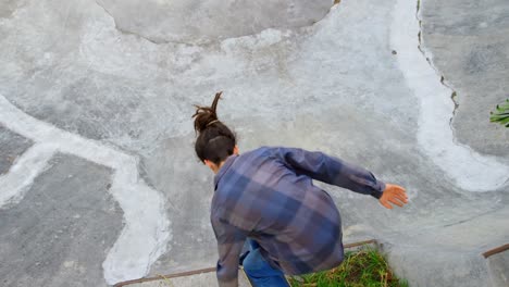 high angle view of young caucasian man practicing skateboarding on ramp in skateboard park 4k