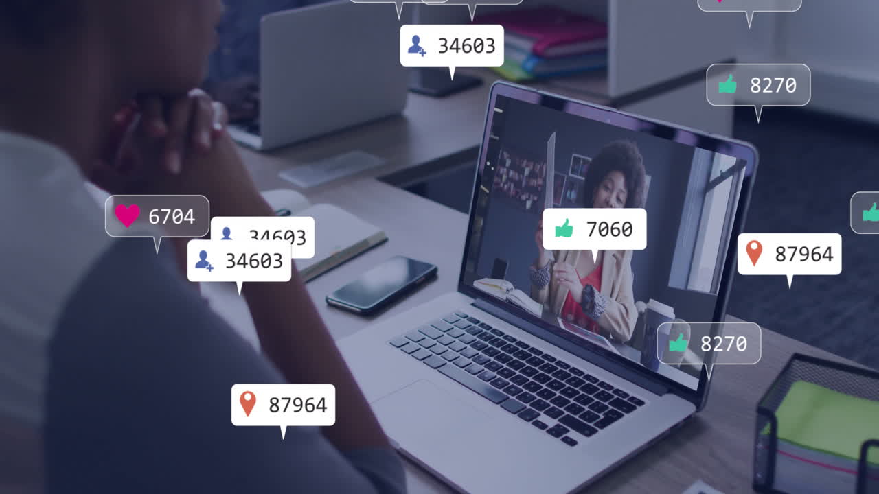 Watching animation on laptop, person in school receiving social media notifications