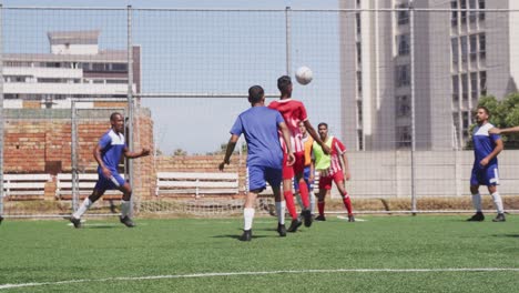 soccer players having match on field