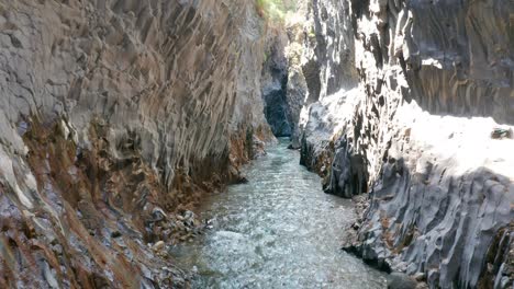 flying inside alcantara river gore in sicily without people