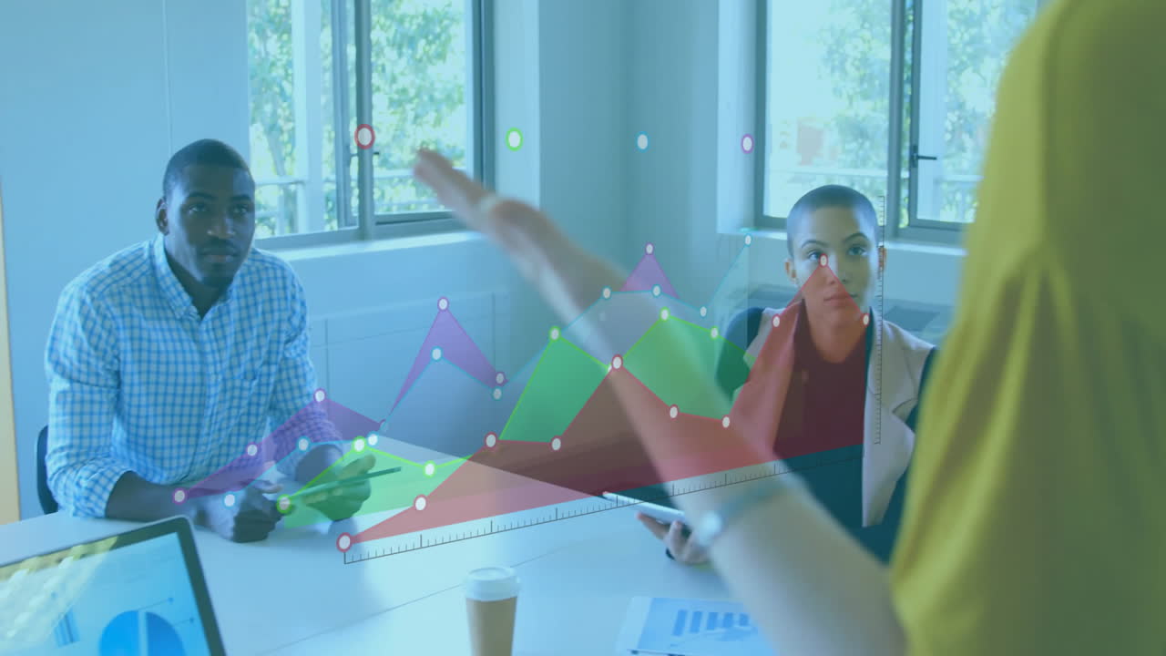 Animation of diagrams over diverse colleagues at meeting in office