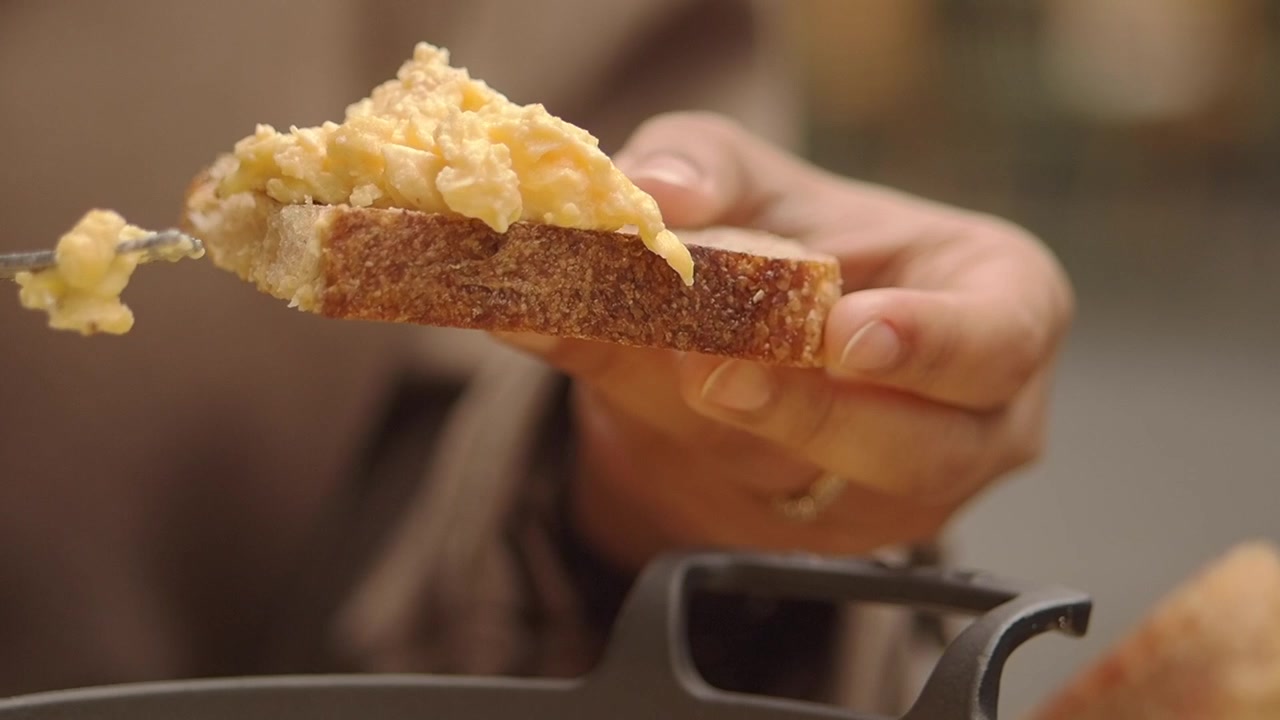 Serving Scrambled Eggs on Toasted Rustic Bread