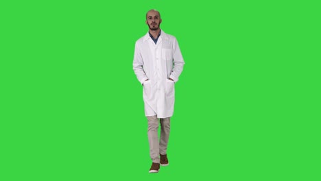 arab handsome doctor wearing his uniform walking with hands in pockets on a green screen, chroma key