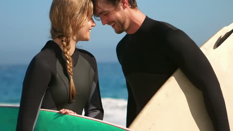 couple standing head against head