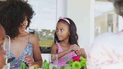 Video-of-african-american-family-spending-time-together-and-having-dinner-outside