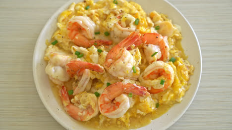 homemade creamy omelet with shrimps or scrambled eggs and shrimps