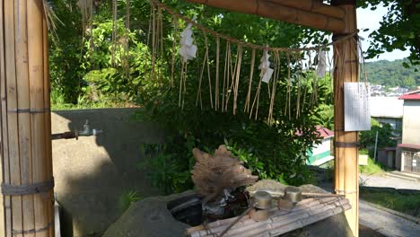 traditional japanese chozuya (water basin) at a shinto shrine