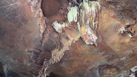 intricate cave formations with stalactites and mineral deposits