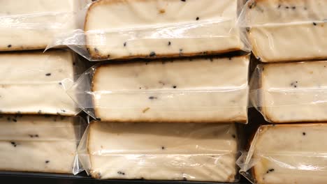 stacked blocks of packaged cheese