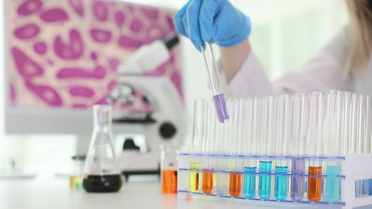 Scientist working in the laboratory with test tubes
