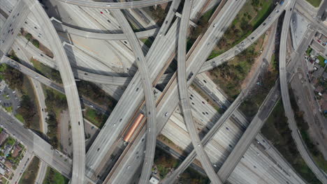 AERIAL:-Spectacular-Turning-Overhead-Shot-of-Judge-Pregerson-Highway-showing-multiple-Roads,-Bridges,-Viaducts-with-little-car-traffic-in-Los-Angeles,-California-on-Beautiful-Sunny-Day