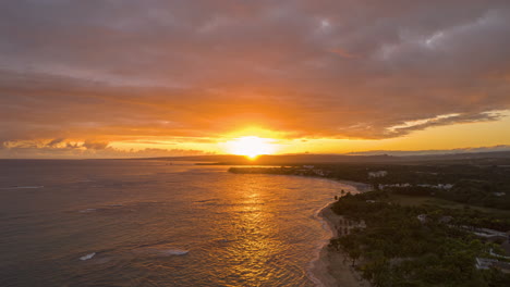 sur rising over the clouds in the coast with a stunning warm beach in the caribbean, stunning sunrise