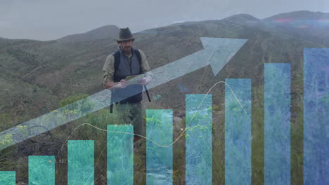 animation of financial data processing over caucasian man hiking in mountains