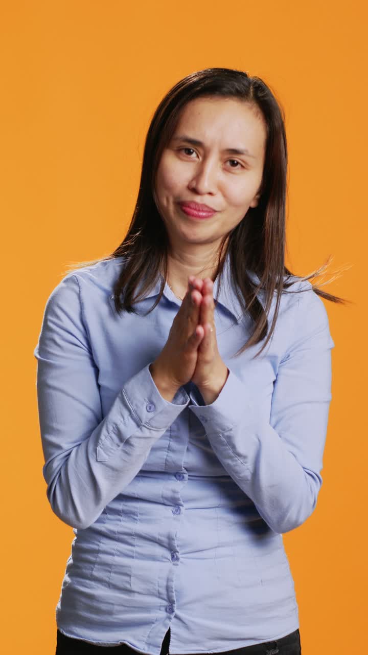 Vertical Video Hopeful person praying to Lord in front of camera