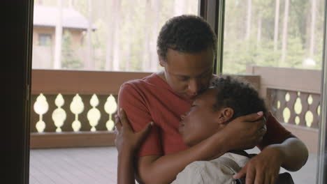 loving mother and her son hugging at home