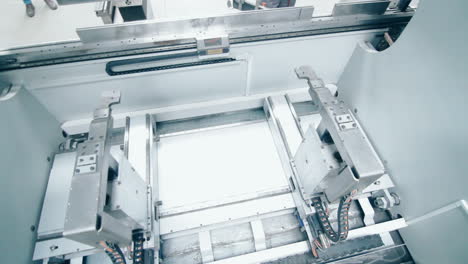 automated line for processing metal parts. production equipment at factory
