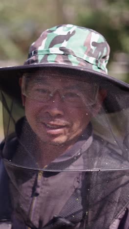 beekeeper wearing protective gear