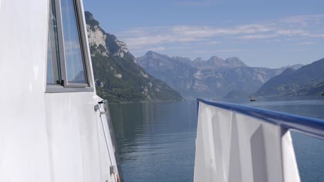 mesmerizing view of swiss alps from tranquil lake walensee, pov from bow of boat, weesen, switzerland