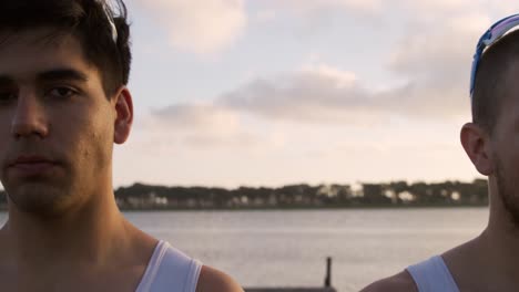 Front view of male rowers looking at camera