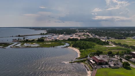 Aerial-approaching-tank-farm-along-Santa-Rosa-Sound-in-Pensacola,-Florida