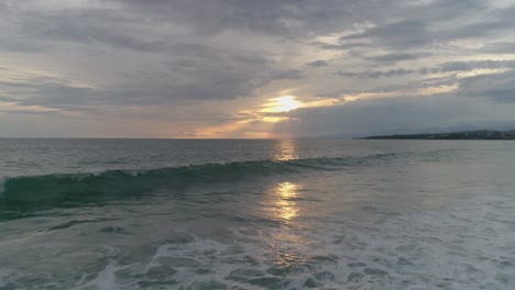 Aerial-shot-of-the-sunset-in-Zicatela-beach,-Puerto-Escondido,-Oaxaca