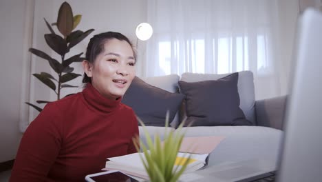 Businesswoman-on-redshirt-using-the-laptop-for-meeting-online-and-work-from-home