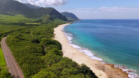 scenic waianae mountains and coastline of makua beach, oahu hawaii, aerial