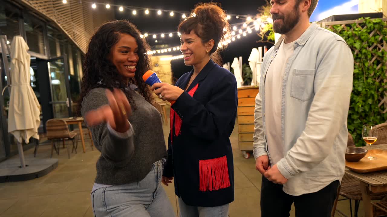 Friends Singing Karaoke on Rooftop