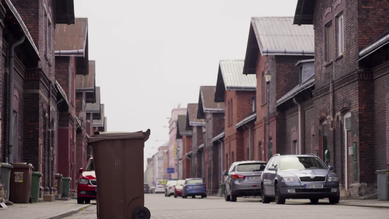 Low-angle shot of a red brick gable colony, a historic workers' housing complex
