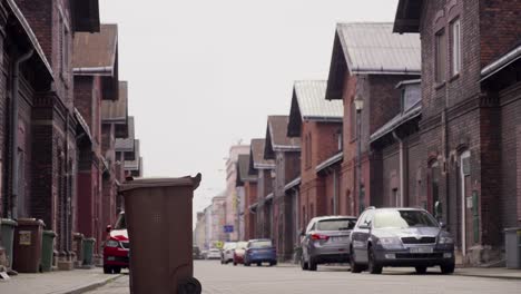 low-angle shot of a red brick gable colony, a historic workers' housing complex