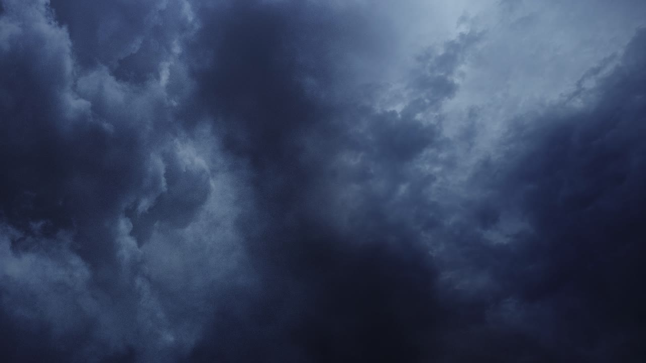 timelapse, dark sky and cumulonimbus clouds moving with thunderstorm