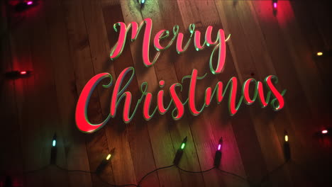 Merry-Christmas-text-and-colorful-garland-on-wood-background