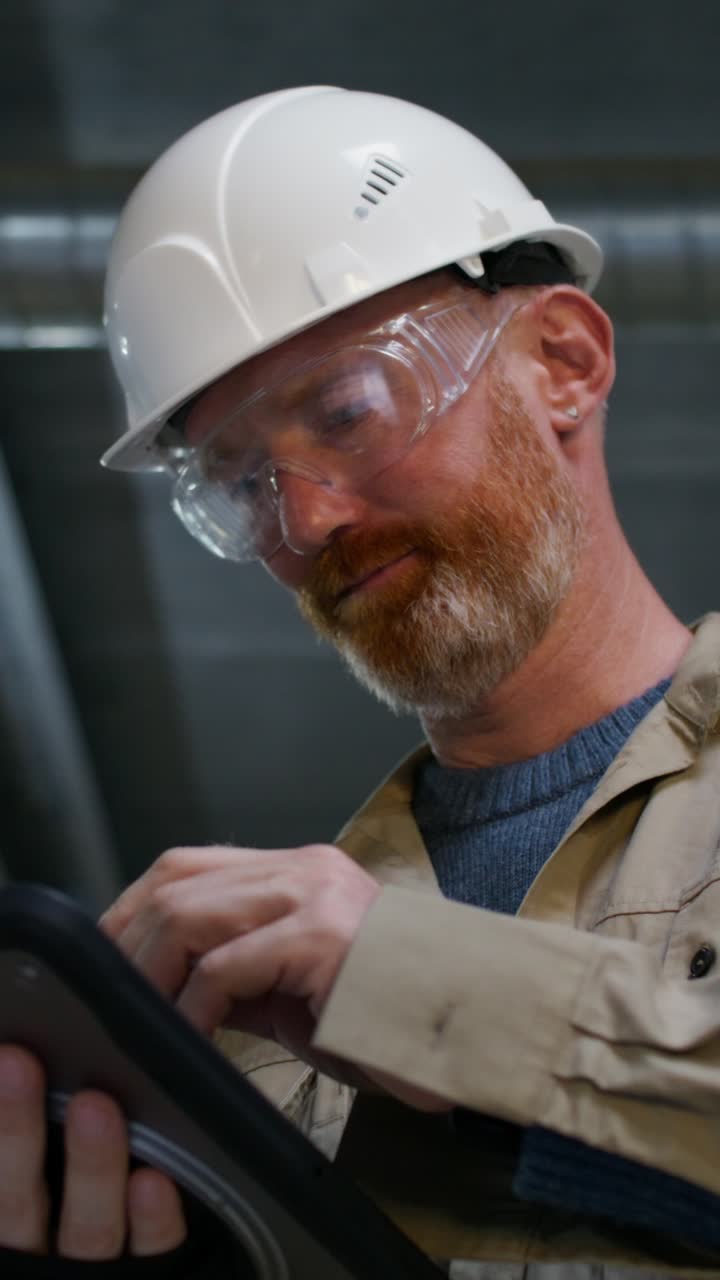 Engineer Reviewing Documentation on Tablet