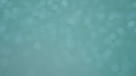 un carrusel de cyan bokeh que parpadea y gira sutilmente