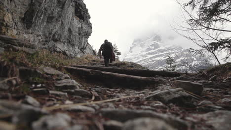 Drained-out-hiker-climbing-uphill-Switzerland-alps