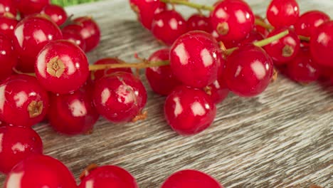 Super-close-macro-of-a-redcurrants-on-a-wooden-table.