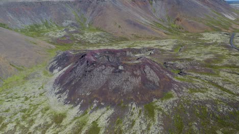 aerial tilt up shot of stóra-eldborg volcano during sunny day in iceland