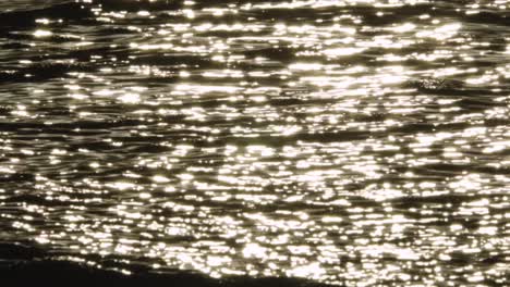 abstract ocean wave ripples on beach shore in slow motion