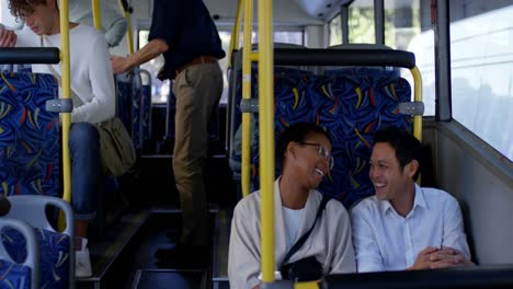 couple interacting with each other while travelling in bus 4k