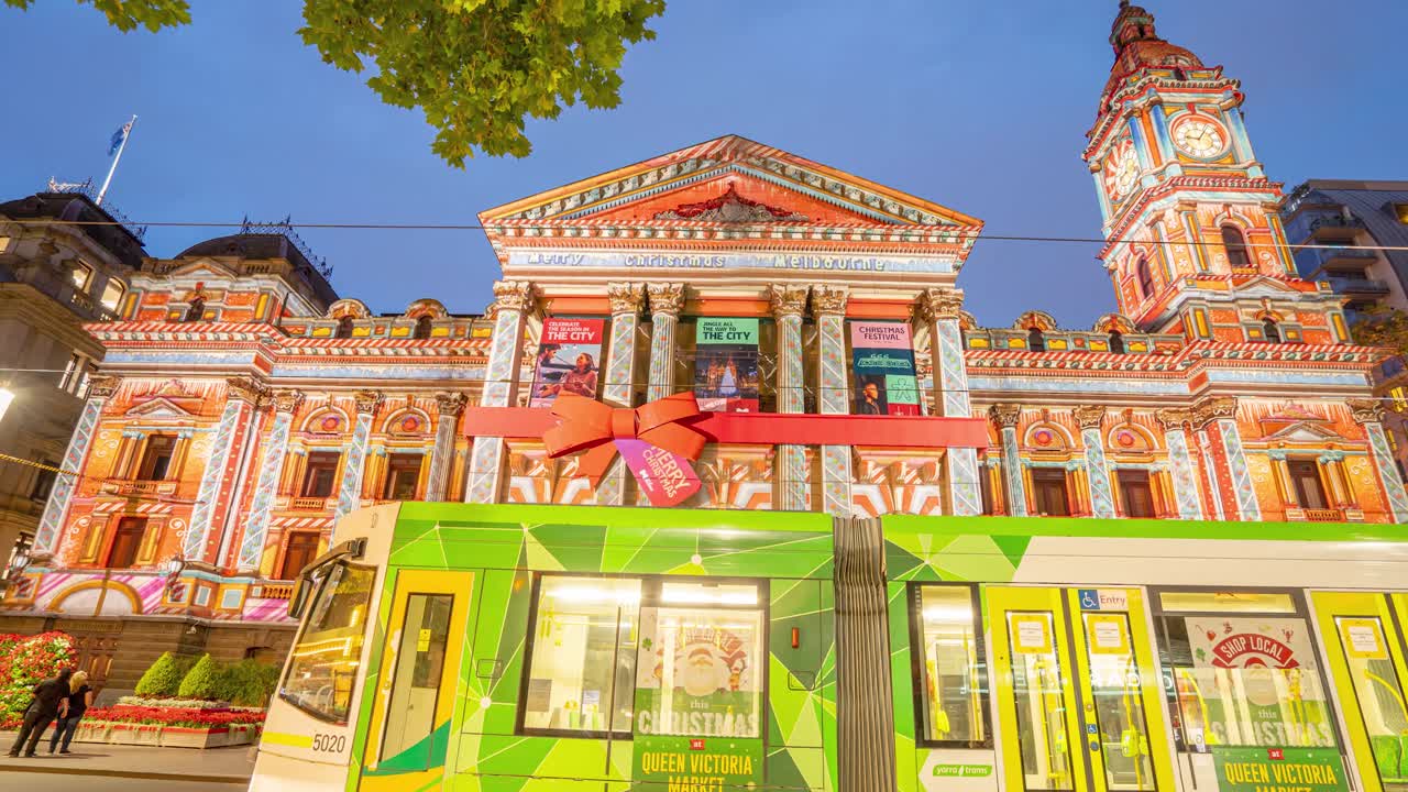 Night Time Lapse of Christmas projections on Melbourne Town Hall Prince Alfred's Tower during Christmas Season Covid-19 period December 2020, Victoria Australia.