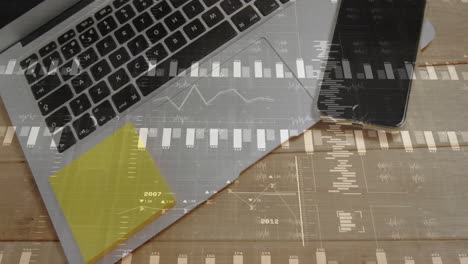 data-driven desk being animated with laptop keyboard, phone, sticky notes and floating charts