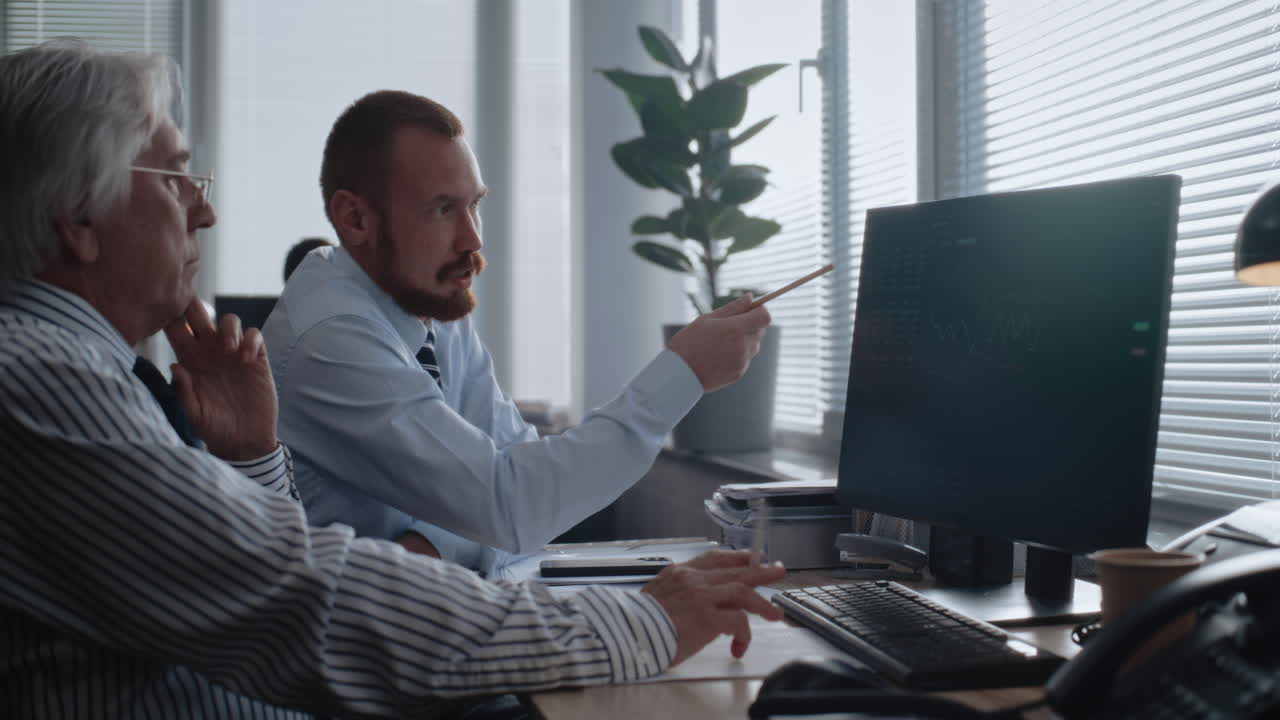 Businessmen Analyzing Financial Data