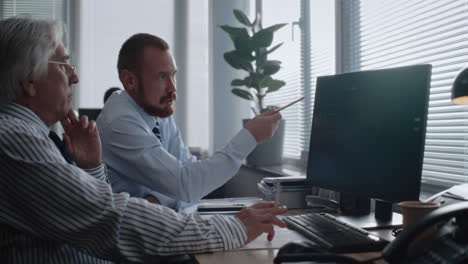 businessmen analyzing financial data