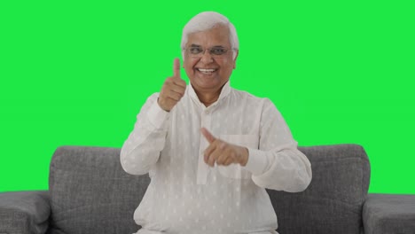 Happy-Indian-old-man-showing-thumbs-up-Green-screen