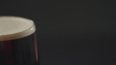 close up of pint of irish stout in glass to celebrate st patricks day 7