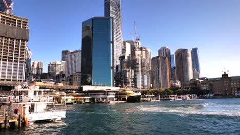 sydney harbor view with skyscrapers and ferries